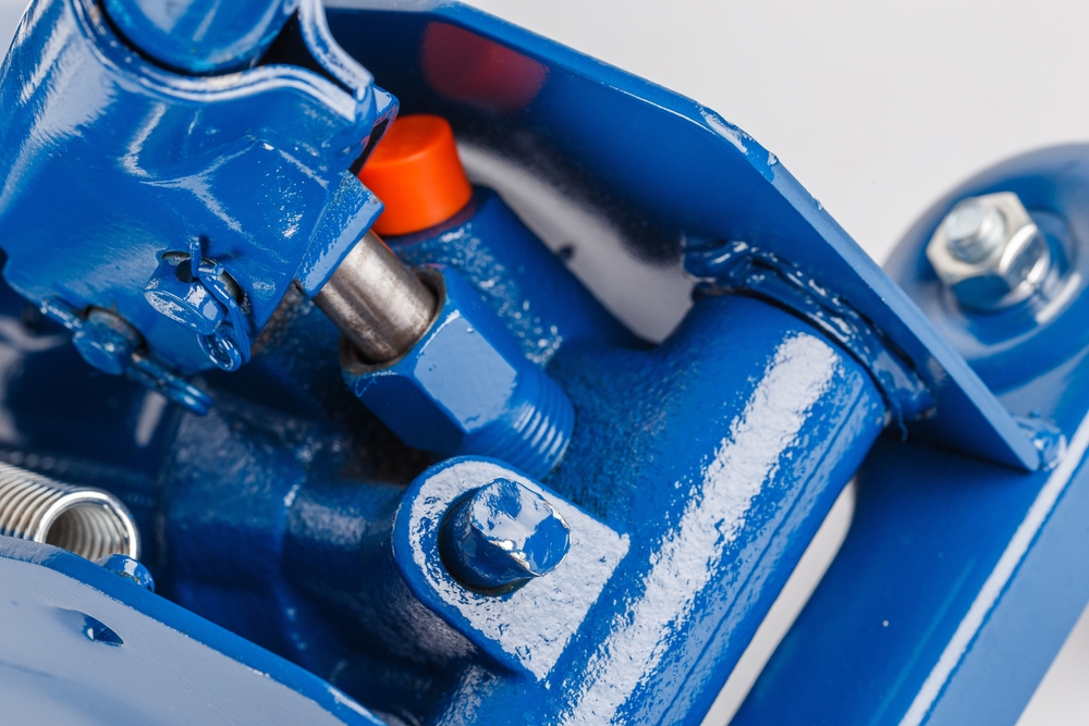 Close Up,view,on,hydraulic,valve,and,piston,of,blue,floor